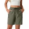 image:imageIWOLLENCE Womens 7 Hiking Shorts Stretch Lightweight Quick Dry Athletic Comfy Summer Long Shorts with 2 Zipper PocketsCarmy Green